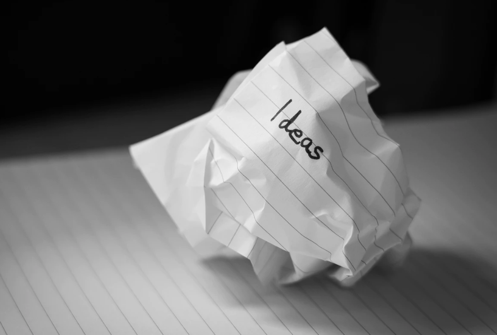 Crumpled paper with the word Ideas written on it